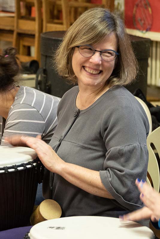 Beth Olson smiling at Drum Circle